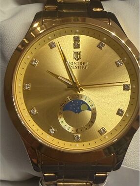 Montres Prestige gold-tone watch with moonphase dial